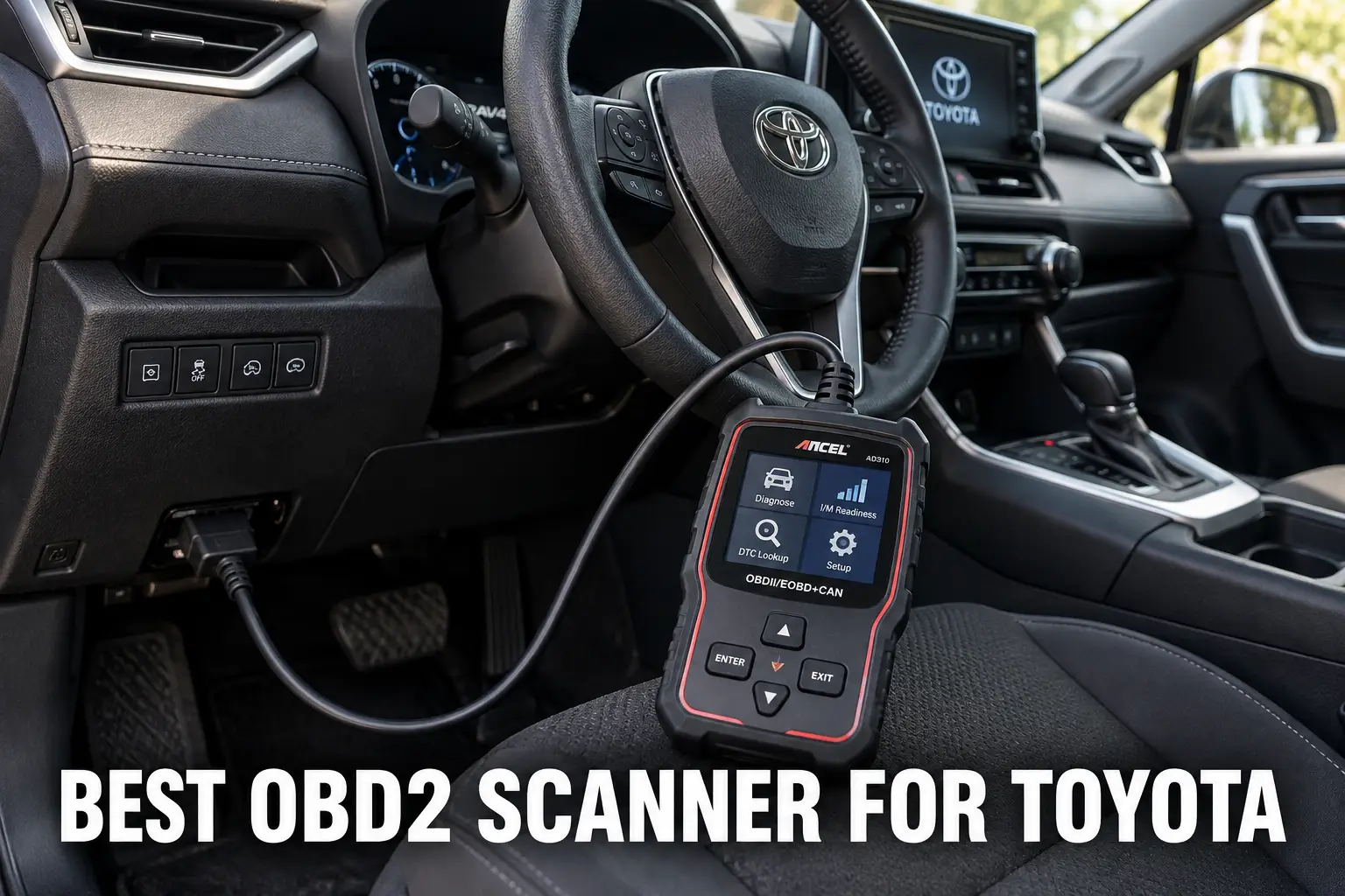 An OBD2 scanner connected inside a Toyota cabin with the diagnostic cable plugged in.