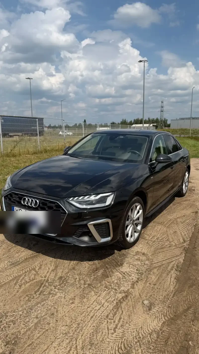 Kamil’s black Audi A4 photographed from the front three-quarter angle outdoors