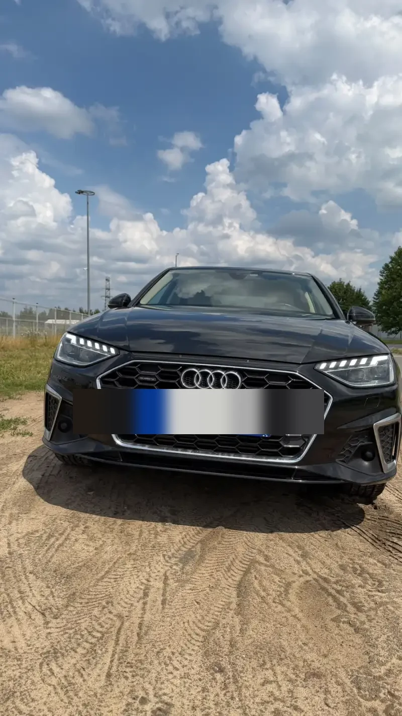Front view of Kamil’s black Audi A4 with LED headlights and Polish license plate