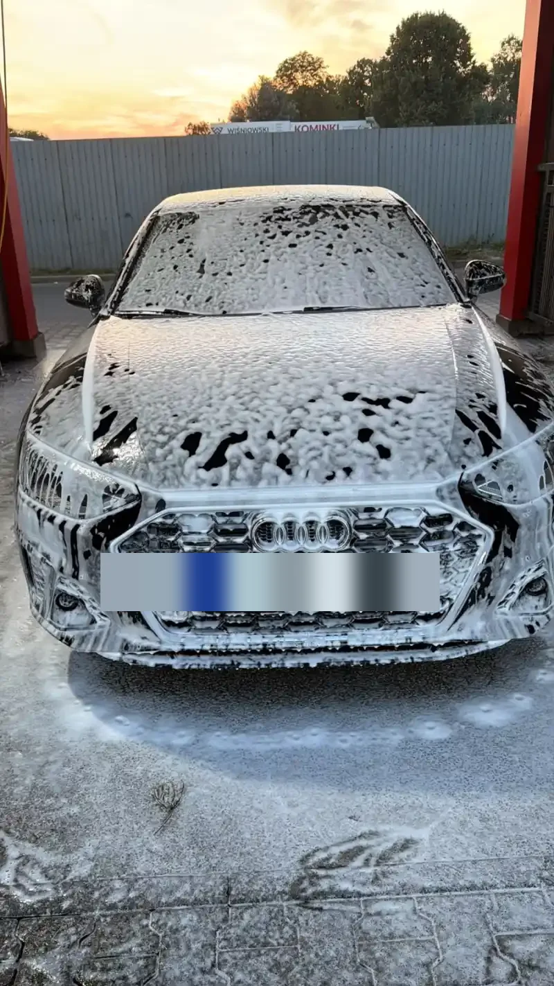 Kamil’s black Audi A4 covered in white foam during a car wash
